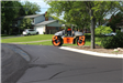 Roller on freshly laid asphalt on Sutters Ln. in the Kirkwood SAD district in Bloomfield Township